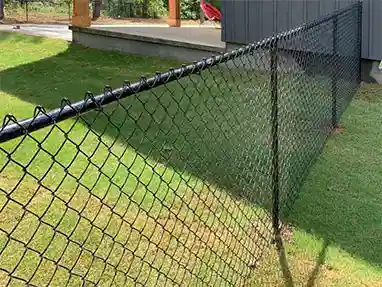 PVC-Coated black chain link fence in a backyard