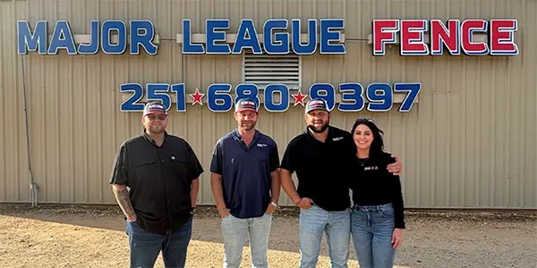 Major League Fence leadership team and owners standing in front of the main location
