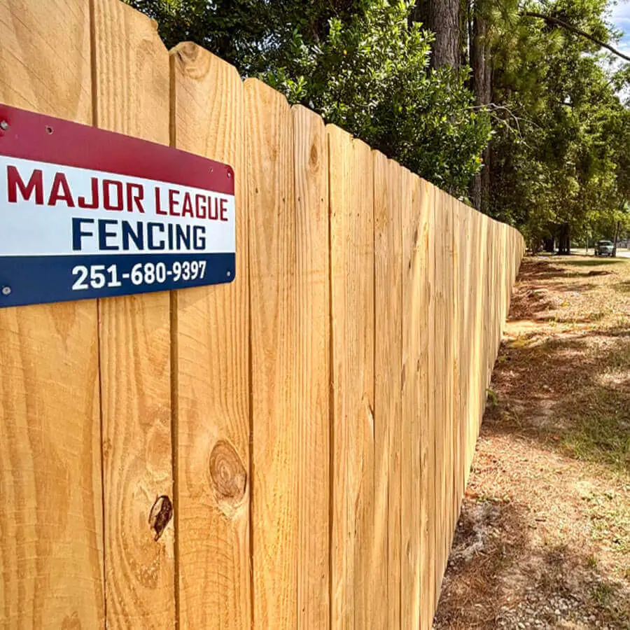 Black chain link fence in the front yard of a house